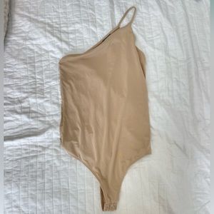 Tan one shoulder bodysuit